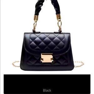 Mini inspired handbag can be worn with or without chain. Black/light blue